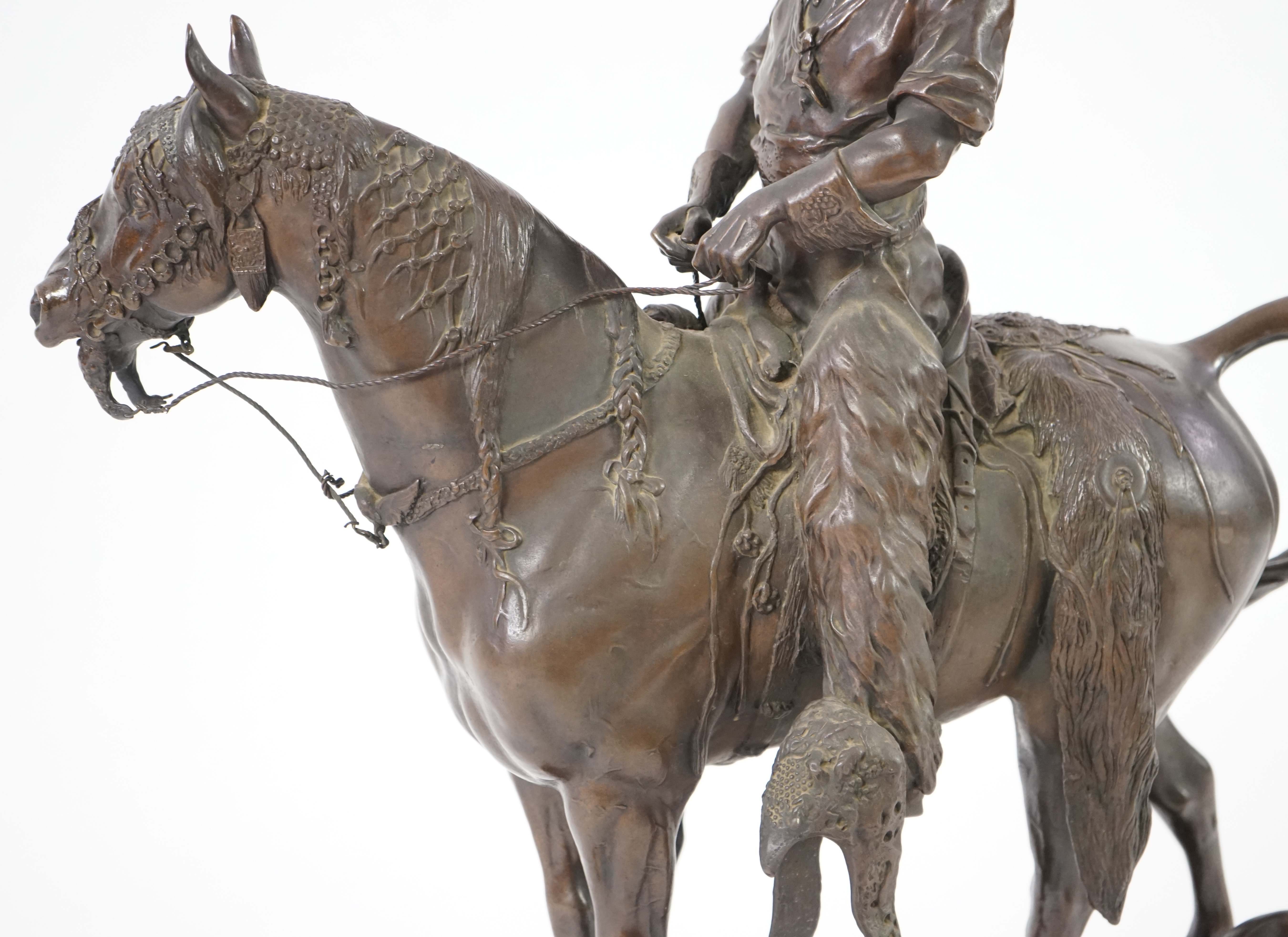 Walter Winans (St. Petersburg, 1852-Parsloe Park, Essex, 1920), a cast bronze of the artist, as a cowboy, riding the Arab stallion Skowronek, 50cm wide, 66cm high, overall 79.5cm high